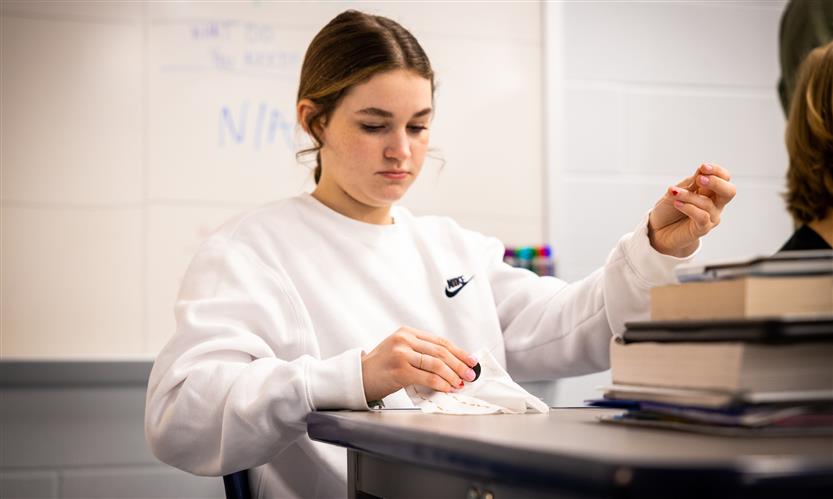 Students practice sewing